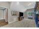 Bedroom with wall-mounted television, window, wood floors, and sitting bench at 7304 Hasentree Club Dr, Wake Forest, NC 27587