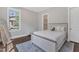 This lovely bedroom has a comfortable bed, soft rug, and a bright window at 7304 Hasentree Club Dr, Wake Forest, NC 27587