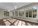 Sun-drenched bonus room featuring hardwood floors and large windows at 7304 Hasentree Club Dr, Wake Forest, NC 27587