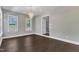 Elegant dining room featuring hardwood floors and a stylish chandelier at 7304 Hasentree Club Dr, Wake Forest, NC 27587