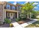 Charming two-story home featuring stone and siding accents, a welcoming front porch, and beautifully landscaped yard at 7304 Hasentree Club Dr, Wake Forest, NC 27587