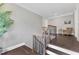 Staircase landing with hardwood floors and railing at 7304 Hasentree Club Dr, Wake Forest, NC 27587