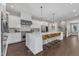 Modern kitchen with white cabinetry, stainless steel appliances, and a spacious island at 7304 Hasentree Club Dr, Wake Forest, NC 27587