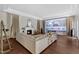 The living room features hardwood floors, a fireplace, and a large projector screen at 7304 Hasentree Club Dr, Wake Forest, NC 27587