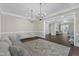 Expansive living area with dark wood floors, a neutral color scheme, and a view into an adjacent room and staircase at 7304 Hasentree Club Dr, Wake Forest, NC 27587