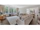 Bright and airy living room featuring hardwood floors, a fireplace, and large windows at 7304 Hasentree Club Dr, Wake Forest, NC 27587