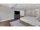 Inviting main bedroom showcasing a cozy bed, hardwood floors, and a modern TV cabinet, offering comfort and style at 7304 Hasentree Club Dr, Wake Forest, NC 27587