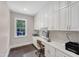 Home office features custom cabinetry, modern appliances, and window at 7304 Hasentree Club Dr, Wake Forest, NC 27587