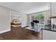 Versatile office featuring natural light, a built-in wet bar, and an open layout, seamlessly connecting to the bedroom at 7304 Hasentree Club Dr, Wake Forest, NC 27587