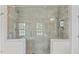 Luxurious walk-in shower features beautiful tile work and a glass door at 7304 Hasentree Club Dr, Wake Forest, NC 27587