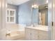 Bathroom featuring a large soaking tub, double sink vanity, and neutral decor at 7405 Chickadee Ct, Sanford, NC 27332