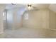 Neutral bedroom with plush carpet, a ceiling fan, and a window with plantation shutters at 7405 Chickadee Ct, Sanford, NC 27332