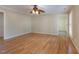 Spacious bedroom with neutral walls, wood flooring, and ceiling fan at 7405 Chickadee Ct, Sanford, NC 27332