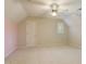 Spacious bedroom with a ceiling fan, a small window, and neutral carpet at 7405 Chickadee Ct, Sanford, NC 27332