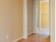 Hallway leading to a bathroom with tile flooring and shower at 7405 Chickadee Ct, Sanford, NC 27332