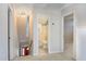 Upstairs hallway leading to the bathroom and stairs at 7405 Chickadee Ct, Sanford, NC 27332