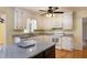 Bright kitchen featuring white cabinets, granite counters, and stainless steel appliances at 7405 Chickadee Ct, Sanford, NC 27332