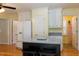 Open kitchen layout with an island, white cabinets, and modern appliances at 7405 Chickadee Ct, Sanford, NC 27332