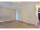 Open-concept living room with hardwood floors, crown moulding, and neutral paint at 7405 Chickadee Ct, Sanford, NC 27332