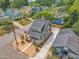 An aerial view of a well-maintained home featuring a spacious driveway and a manicured front yard at 801 N Elm St, Durham, NC 27701