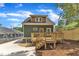 Back exterior view of the home featuring a wooden deck and well manicured yard at 801 N Elm St, Durham, NC 27701