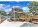 Backyard featuring a new wooden deck, manicured landscaping, and mature trees at 801 N Elm St, Durham, NC 27701