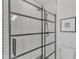 Modern bathroom featuring walk-in shower with black framed glass and geometric tile at 801 N Elm St, Durham, NC 27701