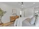 Comfortable bedroom featuring wood flooring, white walls, and decoratively styled furniture at 801 N Elm St, Durham, NC 27701
