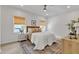 Bright and airy bedroom with a ceiling fan, wood flooring, and a beautifully patterned rug at 801 N Elm St, Durham, NC 27701