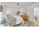 Cozy bedroom featuring hardwood floors, white walls, and decoratively styled furniture at 801 N Elm St, Durham, NC 27701