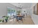 Stylish dining area with modern lighting and a view into the bright, open kitchen at 801 N Elm St, Durham, NC 27701
