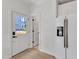 Entryway with door leading into house, and stainless steel refrigerator at 801 N Elm St, Durham, NC 27701