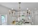 Bright kitchen features modern lighting, white cabinetry, and stainless appliances at 801 N Elm St, Durham, NC 27701