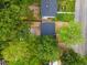 An aerial view displays the property's layout, showcasing the house, yard, and surrounding landscape, and roof color at 805 Camden Ave, Durham, NC 27701