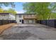 This backyard features a wooden deck, modern fence, and a large concrete patio with landscaping rocks at 805 Camden Ave, Durham, NC 27701
