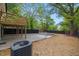 An ample concrete patio and wooden deck highlight a backyard with fresh landscaping and modern fence at 805 Camden Ave, Durham, NC 27701