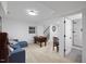 Large finished basement with seating area and foosball, with a door to a new bathroom at 805 Camden Ave, Durham, NC 27701