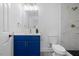 Charming bathroom boasts updated lighting, marble tiling, and sleek fixtures at 805 Camden Ave, Durham, NC 27701