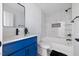 Beautiful bathroom featuring a modern vanity, sleek fixtures, and elegant marble tile in shower at 805 Camden Ave, Durham, NC 27701