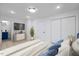 Light and airy bedroom offers a TV, plant, and easy access to an adjacent bathroom at 805 Camden Ave, Durham, NC 27701