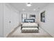 A serene bedroom with a plush bed, neutral tones, and ample natural light at 805 Camden Ave, Durham, NC 27701
