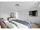 Bright bedroom features a contemporary aesthetic with white walls, soft bedding, and sleek accents at 805 Camden Ave, Durham, NC 27701