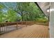 Spacious wooden deck with railing, ideal for outdoor entertaining and relaxation at 805 Camden Ave, Durham, NC 27701