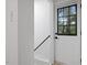 Bright entryway with white door, black hardware and sidelight window, complemented by neutral walls at 805 Camden Ave, Durham, NC 27701