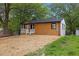 Eye catching single-story home with modern wood facade and minimalist landscape at 805 Camden Ave, Durham, NC 27701