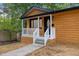 Eye-catching front porch, with a white railing, providing an inviting entrance at 805 Camden Ave, Durham, NC 27701
