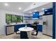 Beautiful kitchen featuring stainless steel appliances, open shelving, and a dining nook at 805 Camden Ave, Durham, NC 27701