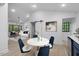 Open-concept living room and dining area provide a welcoming space for gatherings at 805 Camden Ave, Durham, NC 27701