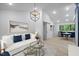 Bright living room featuring modern decor, recessed lighting, and an open floor plan at 805 Camden Ave, Durham, NC 27701