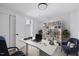 Well-appointed home office with sleek desk, organized shelving, and comfortable seating at 805 Camden Ave, Durham, NC 27701